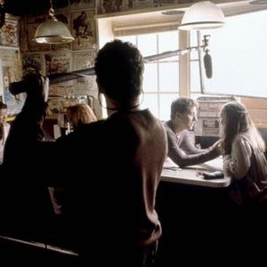 ON THE LINE, background center, seated: Lance Bass, Emmanuelle Chriqui, on set, 2001. (c) Miramax