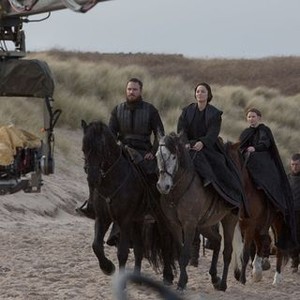 MACBETH, horseback from left: Michael Fassbender as Macbeth, Marion Cotillard as Lady Macbeth, Rebecca Benson, on set, 2015. © The Weinstein Company