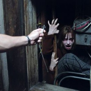 THE CONJURING 2, from left: Patrick Wilson (arm), Madison Wolfe, 2016. © New Line Cinema