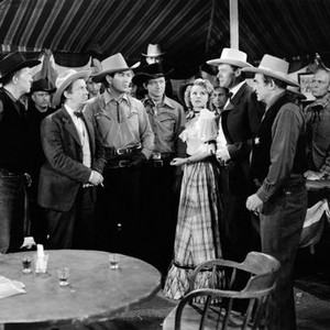 TENTING TONIGHT ON THE OLD CAMP GROUND, second, third, fourth, fifth and seventh from front left: Fuzzy Knight, Johnny Mack Brown, Tex Ritter, Jennifer Holt, Lynton Brent, 1943