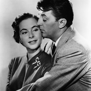 FOREIGN INTRIGUE, from left: Genevieve Page, Robert Mitchum, 1956