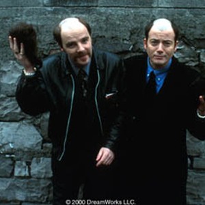 George (Brían F. O'Byrne, left) and Colm (Barry McEvoy) try some creative sales techniques in an effort to corner the toupee market in Northern Ireland.