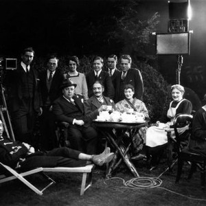 THE FARMER'S WIFE, seated, first five from left: Gordon Harker (lawn chair), director Alfred Hitchcock (hat), Jameson Thomas, Maud Gill, Antonia Brough, 1928