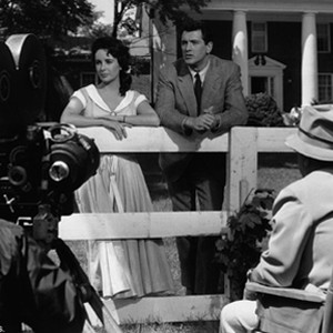 Elizabeth Taylor (Leslie Lynnton Benedict, left) and Rock Hudson (Jordan "Bick" Benedict, right) in front of director George Stevens on the set of Giant. photo 15