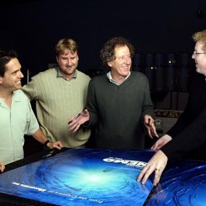 FINDING NEMO, Lee Unkrich, Graham Walters, Geoffrey Rush, Andrew Stanton with the film's poster, 2003, (c) Walt Disney