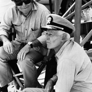 MIDWAY, from left, director Jack Smight, Henry Fonda, on-set, 1976