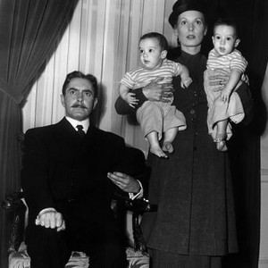 THE LONG GRAY LINE, Tyrone Power, Maureen O'Hara holding identical twins Keith Schultz and Kenneth Schultz posing on set, 1955