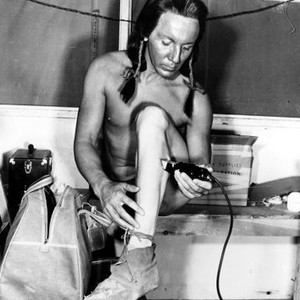 PONY SOLDIER, Cameron Mitchell shaving his legs for his role, 1952