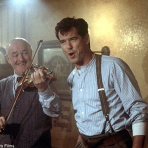 Desmond (PIERCE BROSNAN) and his father, Henry (FRANK KELLY), entertain pub patrons in United Artists' inspiring drama EVELYN. photo 13