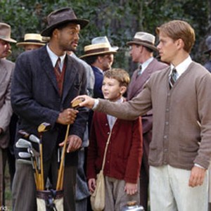 The mysterious caddie named Bagger Vance (WILL SMITH, left) helps golfer Rannulph Junuh (MATT DAMON, right) decide his next move with the help of his young protégé Hardy (J. MICHAEL MONCRIEF). photo 6