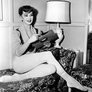 LES GIRLS, Taina Elg, relaxing between scenes,   1957