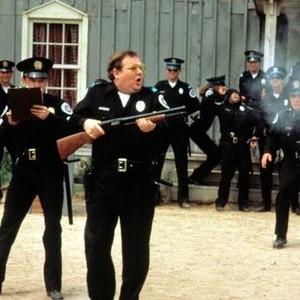 POLICE ACADEMY, Donovan Scott (with rifle), 1984