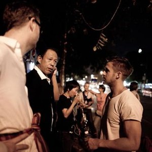 ONLY GOD FORGIVES, from left: director Nicolas Winding Refn, Vithaya Pansringarm, Ryan Gosling, on set, 2013. ph: Kapong 'Shi' Komporiphan/©RADiUS-TWC