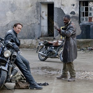 (L-R) Nicolas Cage as Johnny Blaze and Idris Elba as Moreau in "Ghost Rider: Spirit of Vengeance."