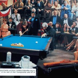 THE BALTIMORE BULLET, leaning over pool table from left: Bruce Boxleitner, James Coburn, Michael Lerner (standind center ), Steve Mizerak (standing rear blue shirt), 1980, © Avco embassy