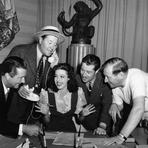 SOMETHING TO SHOUT ABOUT, Loretta Young, center, visits, from left,  William Gaxton, Jack Oakie, Don Ameche, director Gregory Ratoff, on-set, 1943