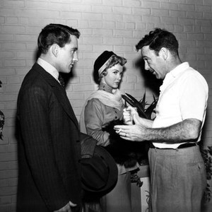SO THIS IS LOVE, On the set Kathryn Grayson and Merv Griffin listen while director Gordon Douglas explains what he wants, 1953