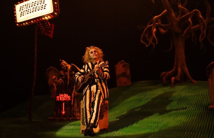 Beetlejuice (Michael Keaton) sings a ditty, in "Beetlejuice Beetlejuice." (Warner Bros. Pictures)