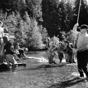 THE BIG SKY, from left, in river, Hank Worden, Dewey Martin, Kirk Douglas, Elizabeth Threatt; director Howard Hawks, in white cowboy hat; on location in Wyoming, 1951