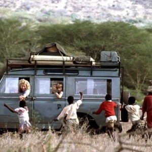 I DREAMED OF AFRICA, Kim Basinger, Liam Aiken, 2000, greeting the natives in Kenya