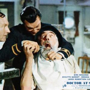 DPCTYPR AT SEA, from left: Maurice Denham, dirk Bogarde, Noel Purcell (open mouth), 1955