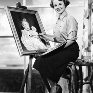 BRANDED, Mona Freeman posing with a portrait she painted of her  daughter, 1950
