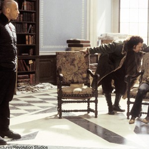 (L.) Xander (Vin Diesel) and (R.) Yelena (Asia Argento) are entangled in the undercover operative called Anarchy 99 headed by (C.) Yorgi (Marton Csokas) in photo 3