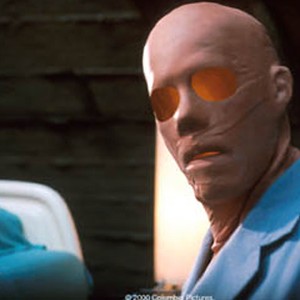 Kevin Bacon uses a latex mask to fit into society.