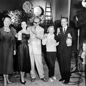INTERLUDE, the international cast toasting the film with their native drinks (l to r): Francoise Rosay (French champagne), Marianne Koch (German beer), director Douglas Sirk (Rhine wine), June Allyson (American stinger), Rossanno Brazzi (Italian chianti, o