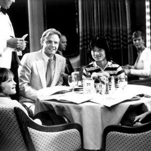 TABLE FOR FIVE, Clockwise from bottom left: Robby Kiger, Jon Voight, Son Hoang Bui, Roxana Zal 1983. ©Warner Bros.