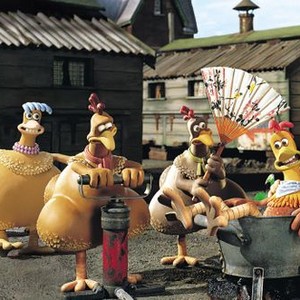 CHICKEN RUN, 2000, Rocky (Mel Gibson), pampered by the hens. Babs (Jane Horrock) at far left.