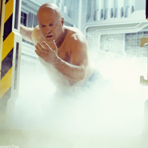 Ben Grimm (Michael Chiklis) emerges from a chamber in which he was the subject of a scientific experiment.