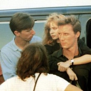 THE UNBELIEVABLE TRUTH, director Hal Hartley (blue shirt), Adrienne Shelly (arms around neck), Robert John Burke on set, 1989, © Miramax