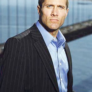 Rob Estes as Tom Hogan