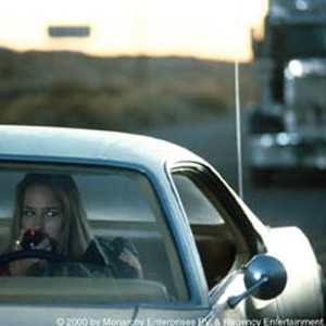 Leelee Sobieski eyes a foreboding truck that has been following her. photo 5
