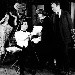 BEYOND THE ROCKS, from left: Gloria Swanson, Rudolph Valentino, author Elinor Glyn, director Sam Wood in posed gag shot on set, 1922