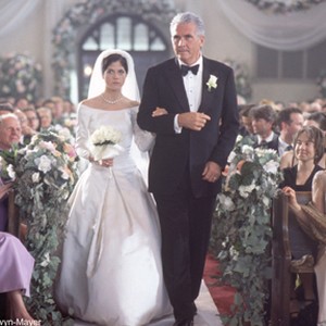 Karen (SELMA BLAIR) is walked down the aisle by her father, Ken (JAMES BROLIN), while her mother, Sandra (DIANA SCARWID) looks on in MGM Pictures' comedy A GUY THING. photo 16