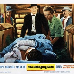 THE HANGING TREE, standing left from second from left: Gary Cooper, Ben Piazza, Karl Swenson, Maria Schell (lying down), 1959