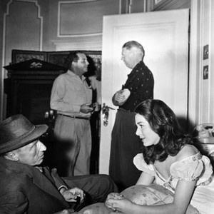 INTERLUDE, director Douglas Sirk discussing a scene with Marianne Koch, on set, 1957