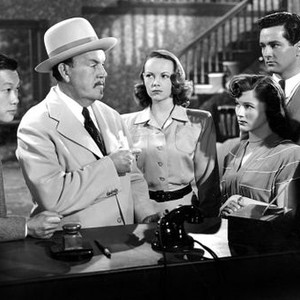 DARK ALIBI, from left: Benson Fong, Sidney Toler, Teala Loring (3rd from right), George Holmes (2nd from right), 1946