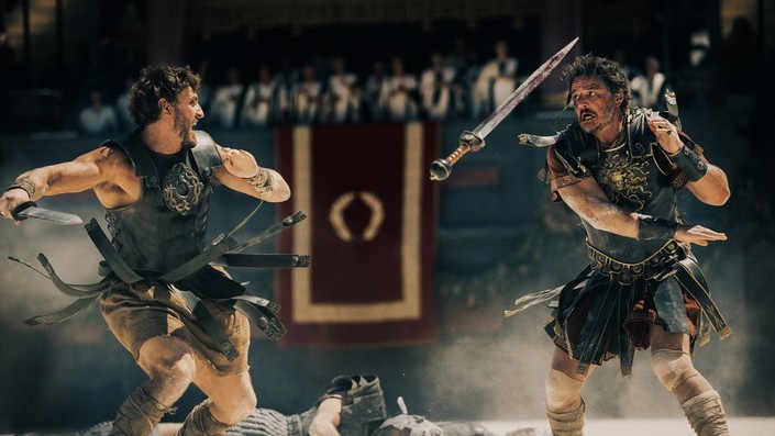 Lucius (Paul Mescal, L) and Marcus Acacius (Pedro Pascal) fight in the Collosseum, in "Gladiator II." (Paramount Pictures)