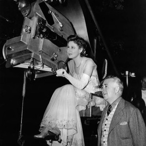 THE WHITE CLIFFS OF DOVER, Irene Dunne with director, Clarence Brown, on set, 1944