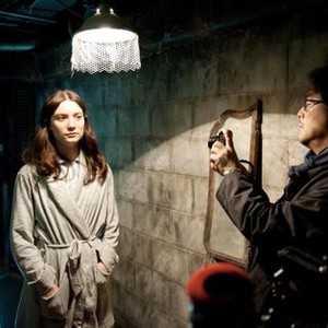 STOKER, from left: Mia Wasikowska, director PARK Chan-wook, on set, 2013. ph: Macall Polay/TM & copyright ©Fox Searchlight. All rights reserved