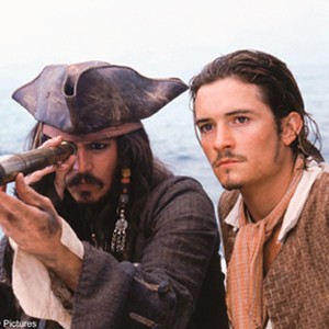 Jack Sparrow (Johnny Depp, left) and Will Turner (Orlando Bloom, right) join forces on the fastest ship in the British fleet, the H.M.S. Interceptor