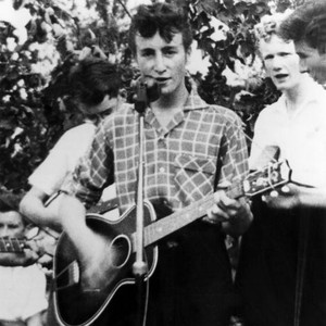 John Lennon at the microphone performing with the Quarry Men Skiffle Group in Liverpool on the day he would meet Paul Mccartney, 7/6/57