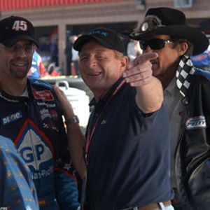 Director Simon Wincer points the way to two members of the well-known Petty racing dynasty, Kyle and his father Richard. photo 15