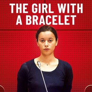 The girl deals with a bracelet