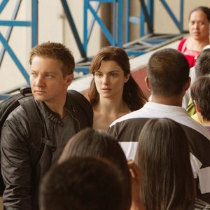 THE BOURNE LEGACY, Jeremy Renner (left), Rachel Weisz (center of frame), 2012. ph: Mary Cybulski/©Universal Pictures