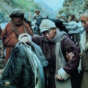 KUNDUN, Tenzin Thuthob Tsarong (eyeglasses) as the Dalai Lama, Gyatso Lukhang (hand on arm), 1997, © Buena Vista