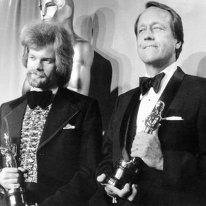 From left: writer David S. Ward, director George Roy Hill, holding their Oscar statuettes for THE STING, at the Academy Awards, 1974
